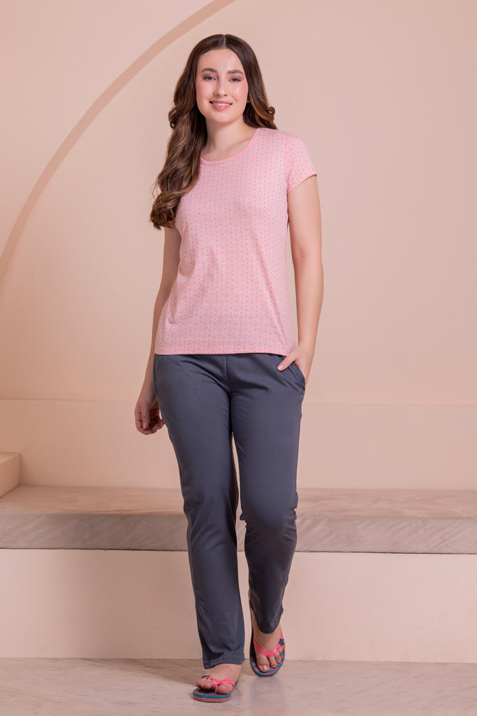 A woman wearing a regular sleeve, relaxed fit, printed cotton night suit  in Lite Pink color
