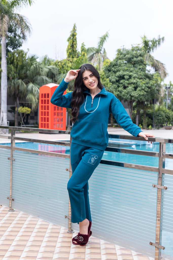  A woman wearing a full sleeve, relaxed fit, solid cotton cord set in rust teal
