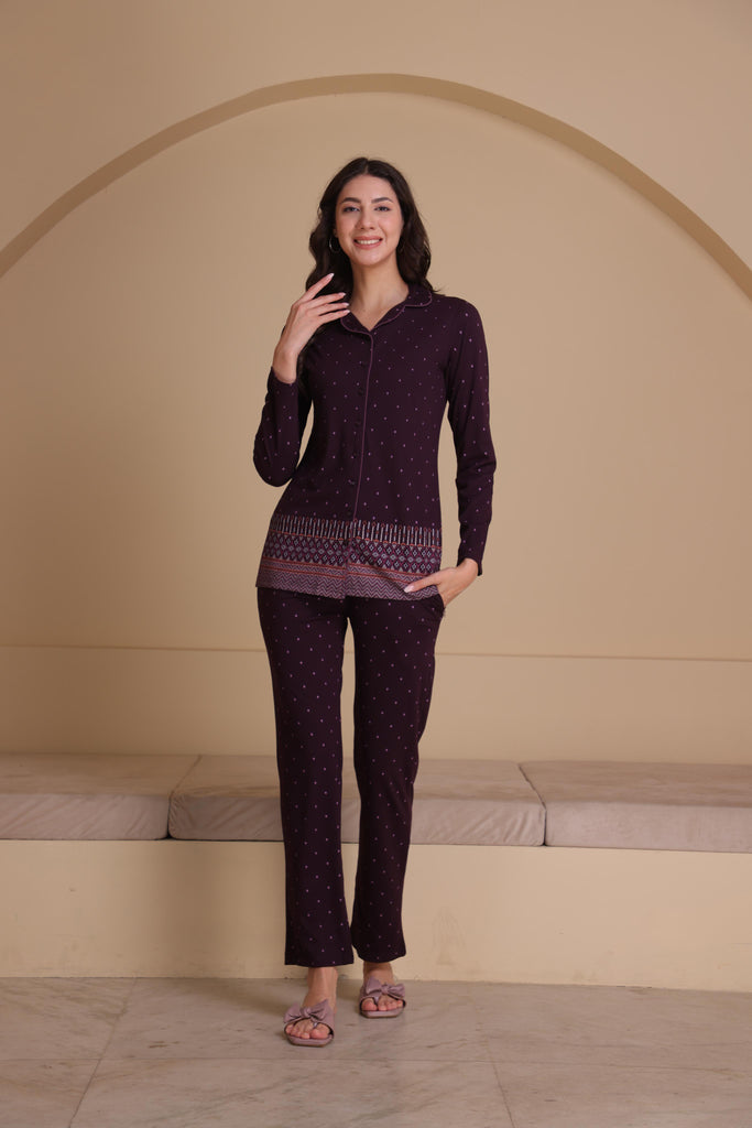 A woman wearing a  full sleeve, relaxed fit,  printed cotton cord set with lapel collar  in Wine color