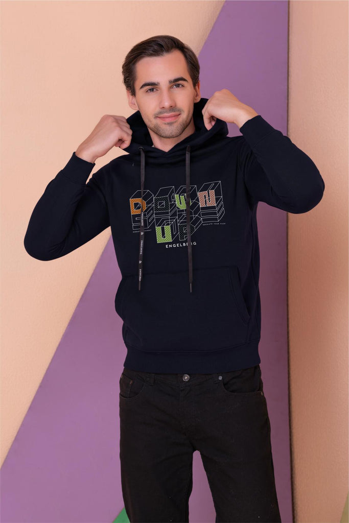  A  man wearing a full sleeve, relaxed fit, fleece printed hoodie with elasticed cuff and hem in navy Color 
