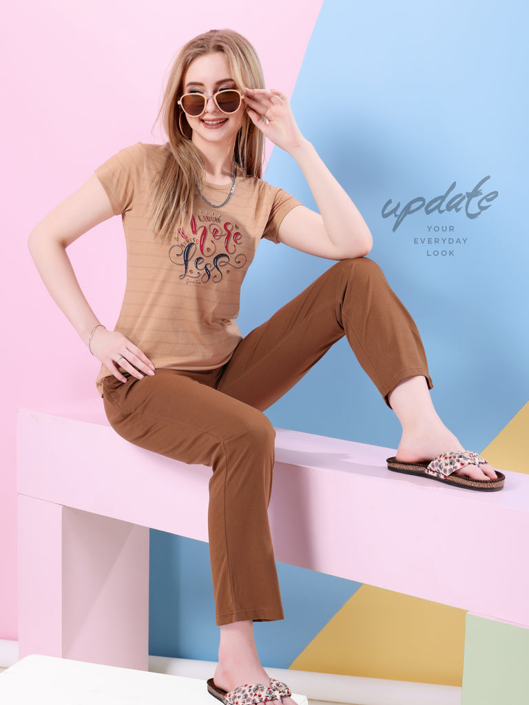 A woman wearing a regular sleeve, relaxed fit, printed cotton night suit  in camel color